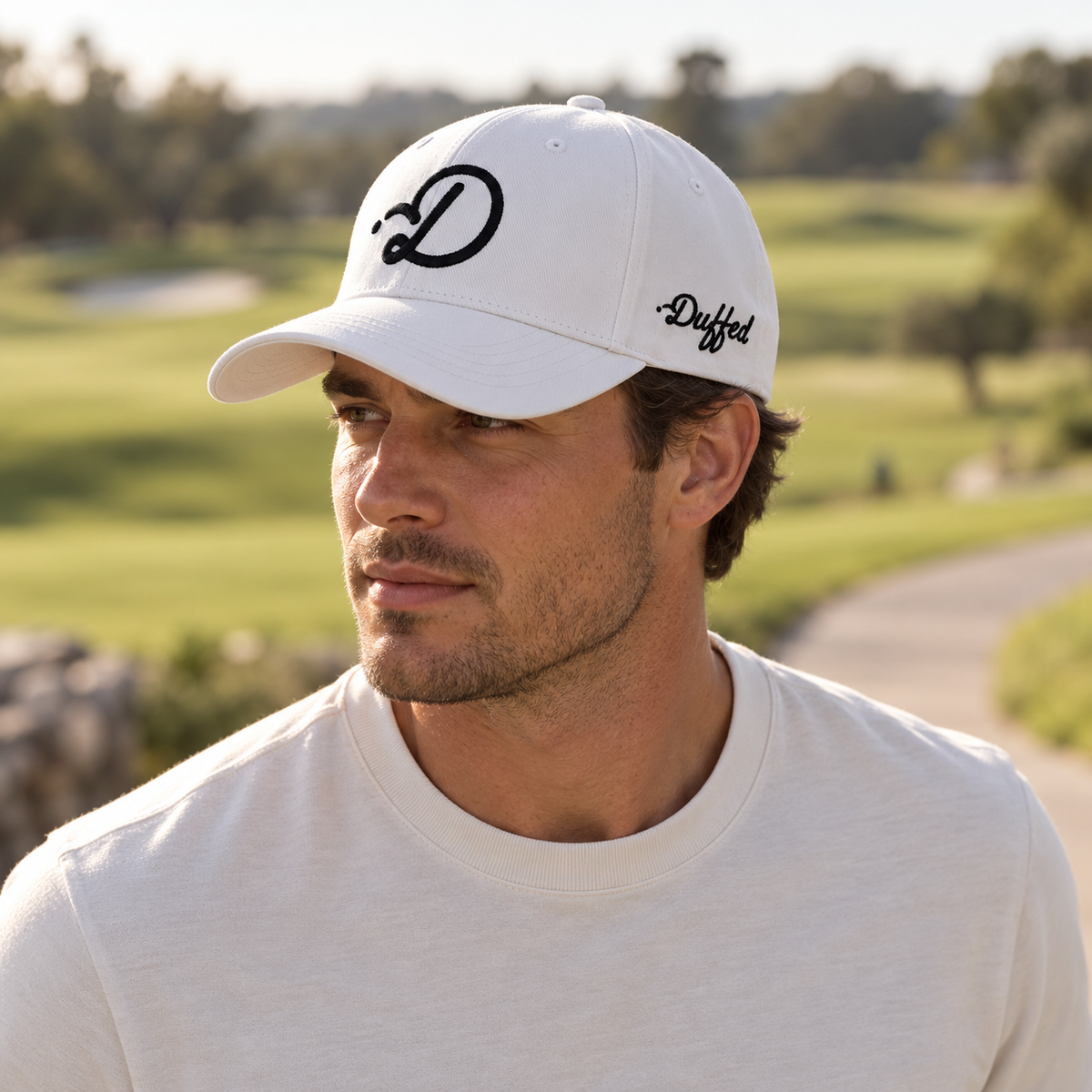 Duffed Alpine D Cap — male lifestyle portrait on the course