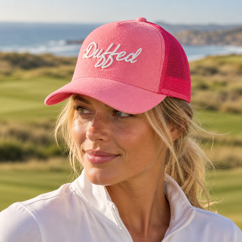 Duffed Azalea Script Trucker — close-up coastal golf lifestyle photograph
