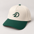 Duffed Clubhouse D Cap in cream and forest green — studio product photograph