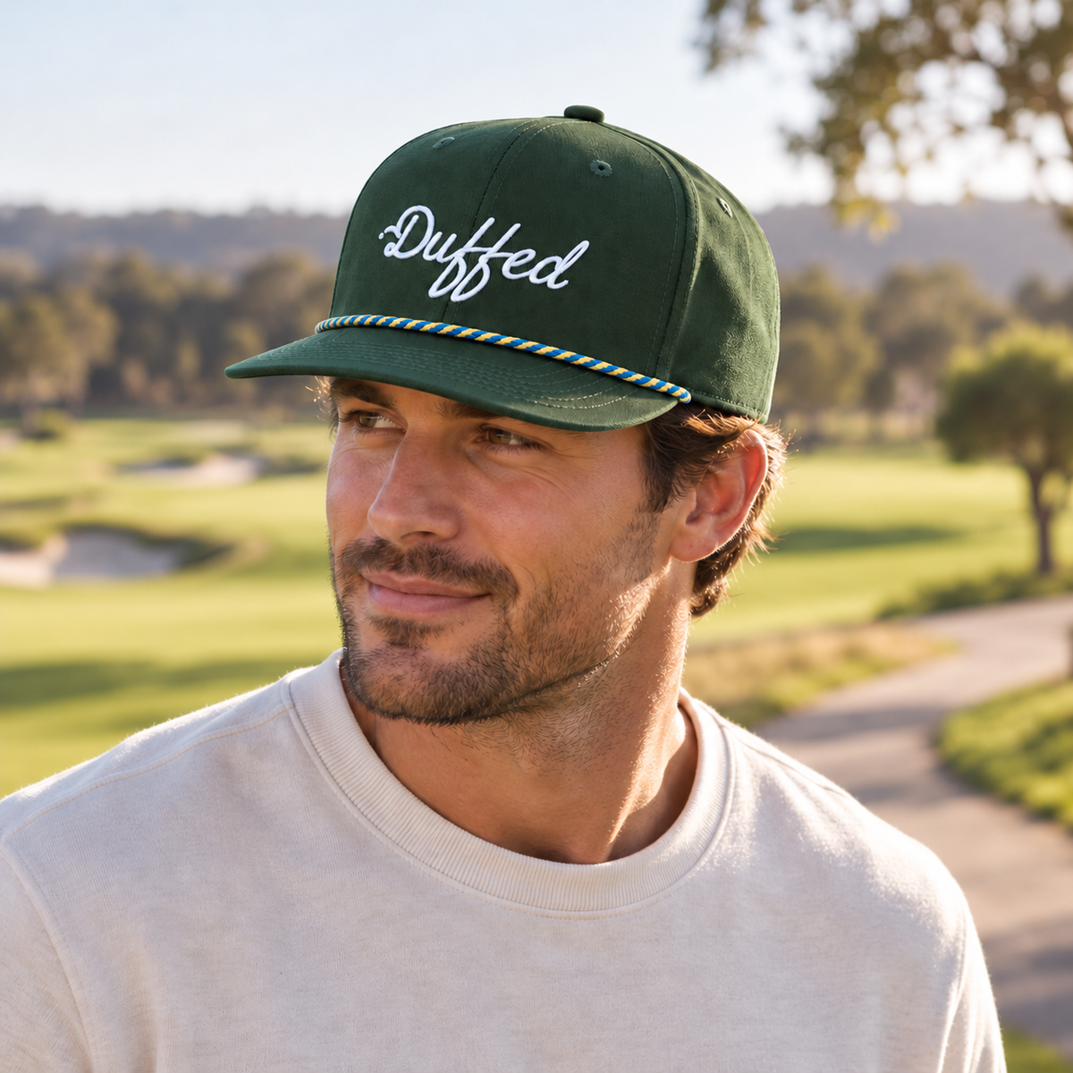 Duffed Fairway Script Rope Cap — male lifestyle portrait on the course