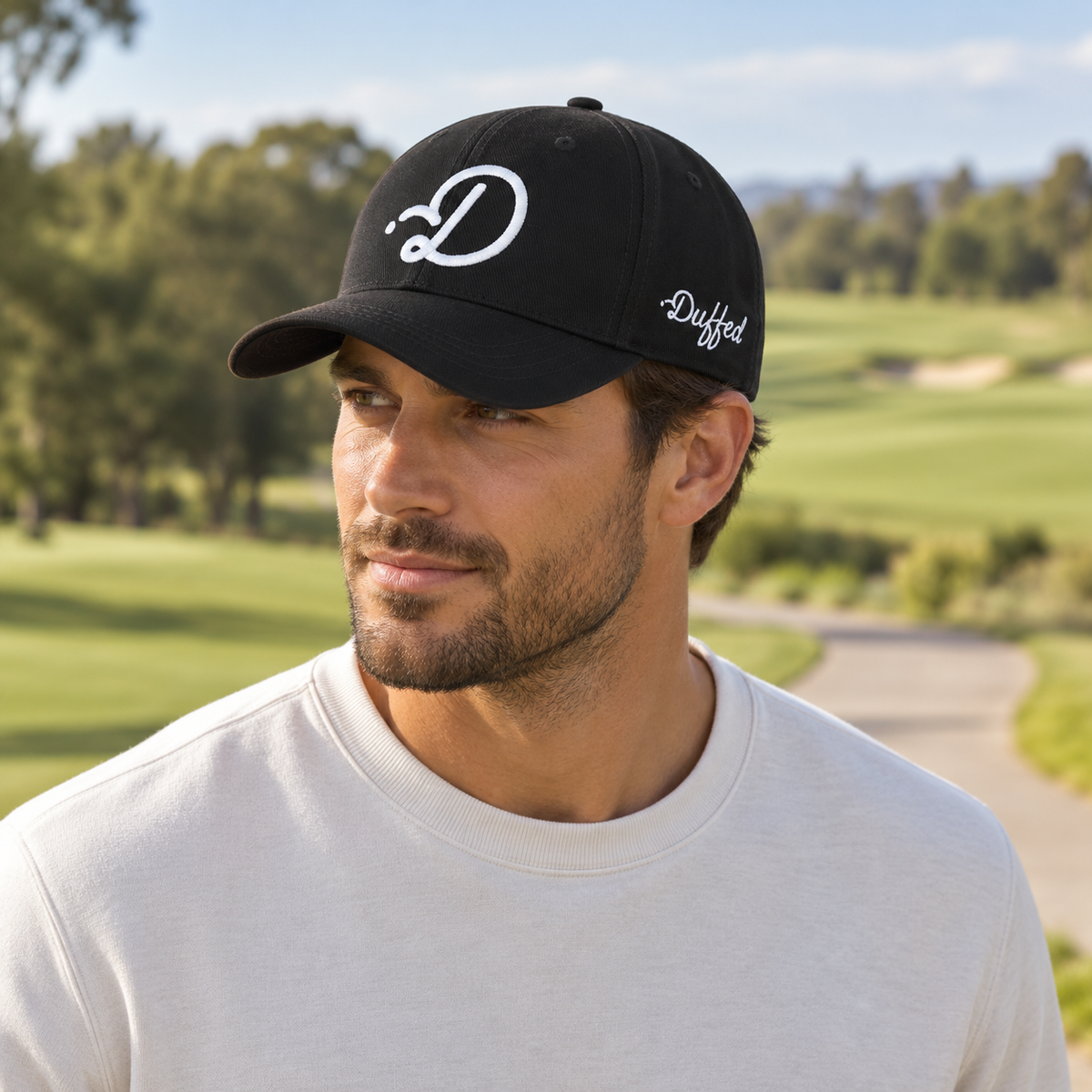 Duffed Obsidian D Cap — male lifestyle portrait on the course